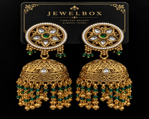 Traditional gold-tone jhumka earrings with green beads, pearl detailing and white stones