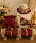Luxury bridal jewellery set with red bridal chura and potli bag