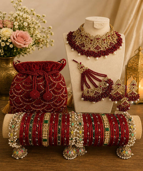 Luxury bridal jewellery set with red bridal chura and potli bag